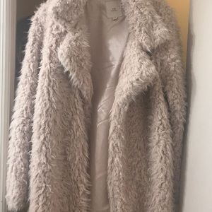Brand new faux fur jacket. Worn one time. Excellent condition.